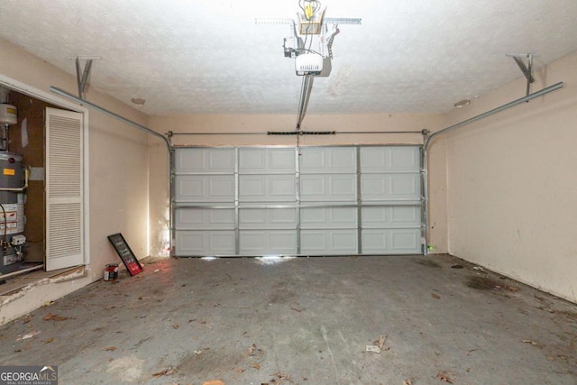 garage featuring strapped water heater and a garage door opener