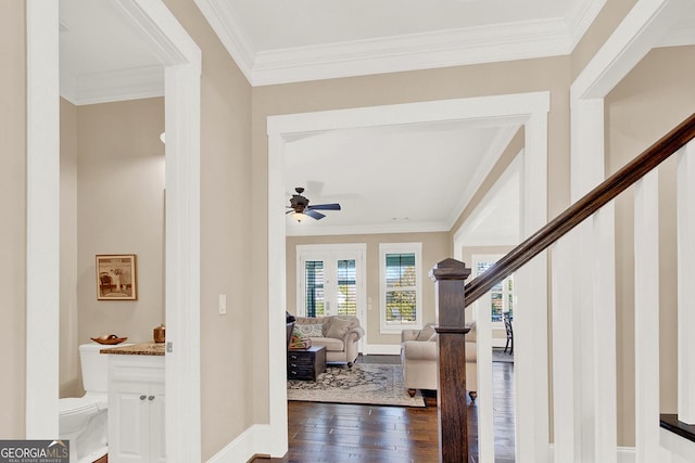 entrance foyer with baseboards, stairway, dark wood-style flooring, and crown molding