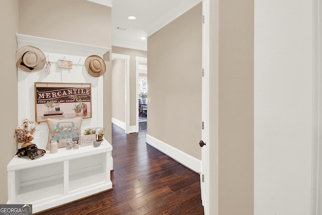 hallway featuring dark wood-style floors, crown molding, recessed lighting, and baseboards