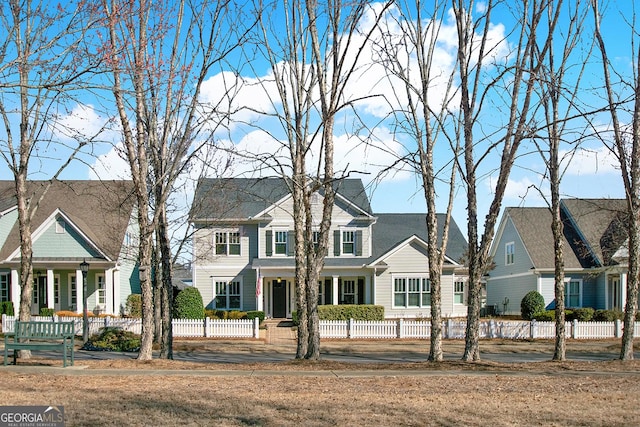 view of front of property featuring a fenced front yard and a residential view