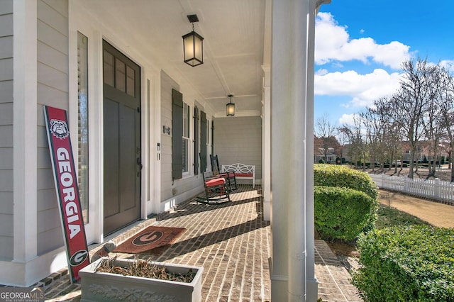 doorway to property with covered porch