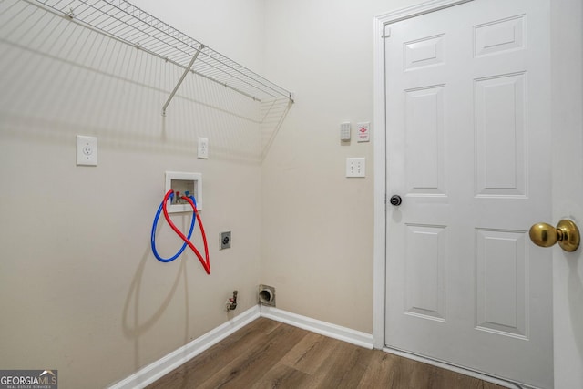 clothes washing area with laundry area, dark wood-type flooring, washer hookup, baseboards, and electric dryer hookup