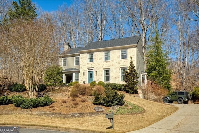 colonial inspired home with a chimney