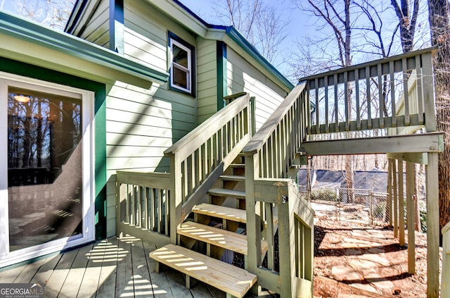 wooden deck with stairs and fence