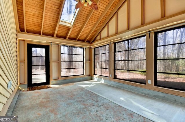 unfurnished sunroom featuring wooden ceiling and lofted ceiling with skylight