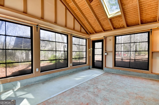 unfurnished sunroom with lofted ceiling with skylight and wooden ceiling