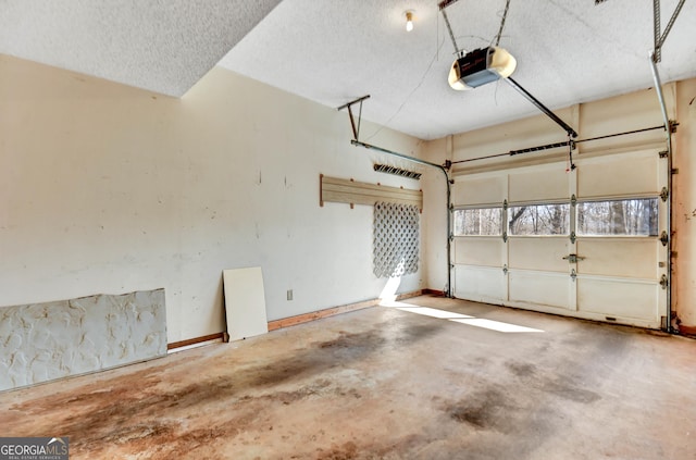 garage with a garage door opener and baseboards