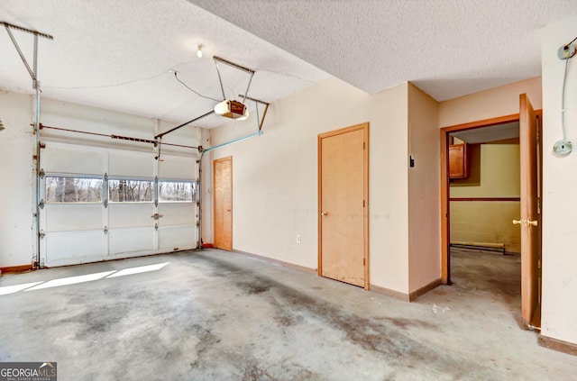 garage featuring baseboards and a garage door opener