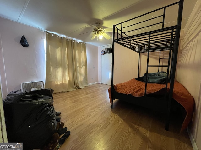 bedroom featuring light wood-type flooring and a ceiling fan