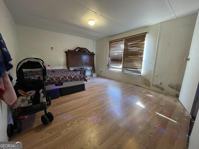 bedroom with wood finished floors