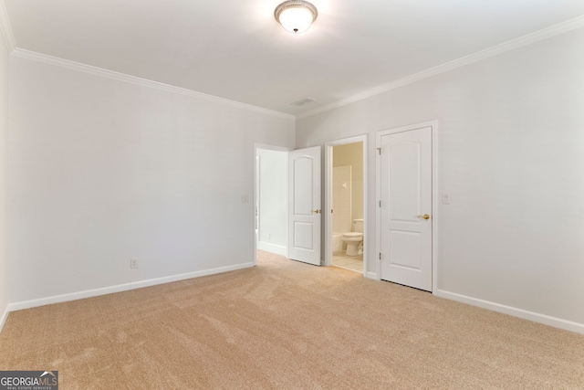 unfurnished bedroom with carpet, connected bathroom, baseboards, and crown molding