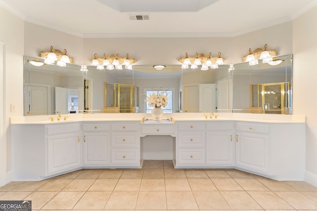 bathroom featuring tile patterned flooring, visible vents, a sink, and a shower stall