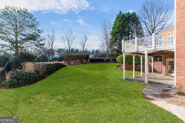 view of yard featuring a wooden deck