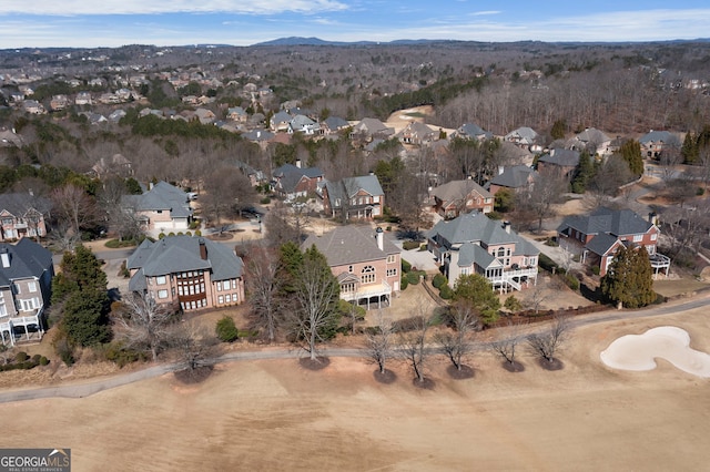 drone / aerial view featuring a residential view and a mountain view