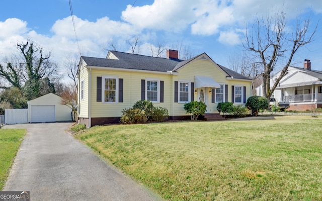 view of front of house with an outdoor structure, a front lawn, a garage, crawl space, and aphalt driveway