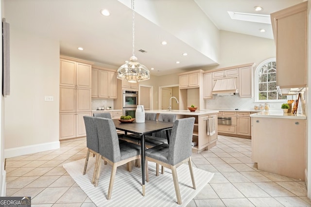 dining space with a skylight, visible vents, recessed lighting, and light tile patterned floors