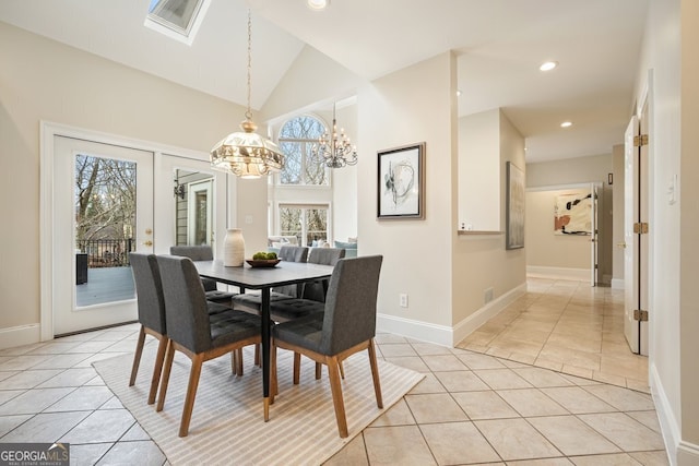 dining area with light tile patterned floors, recessed lighting, an inviting chandelier, high vaulted ceiling, and baseboards