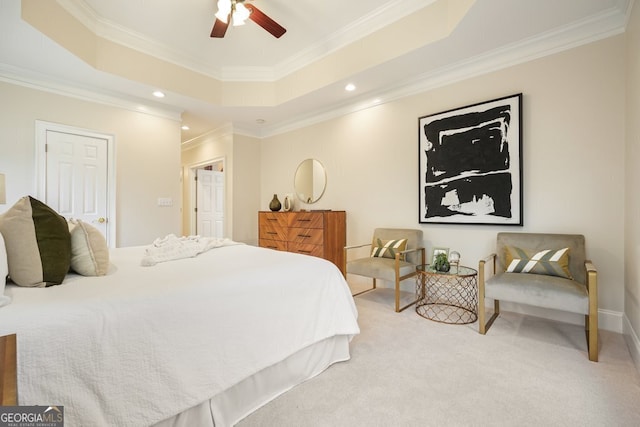 carpeted bedroom with a tray ceiling, crown molding, and recessed lighting