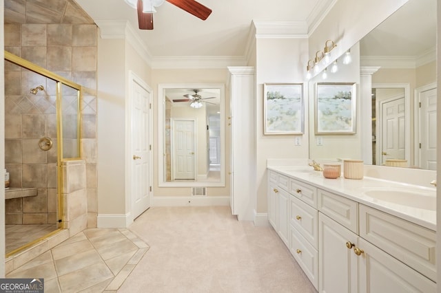 bathroom with ornate columns, ornamental molding, and a sink