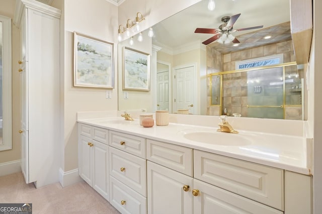 full bathroom with double vanity, a stall shower, ornamental molding, and a sink