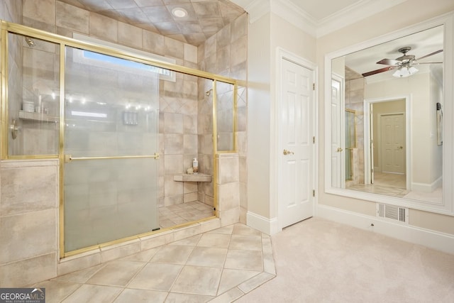 bathroom featuring baseboards, visible vents, a ceiling fan, crown molding, and a shower stall