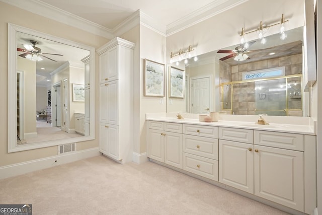 bathroom featuring visible vents, ornamental molding, a stall shower, a sink, and ceiling fan