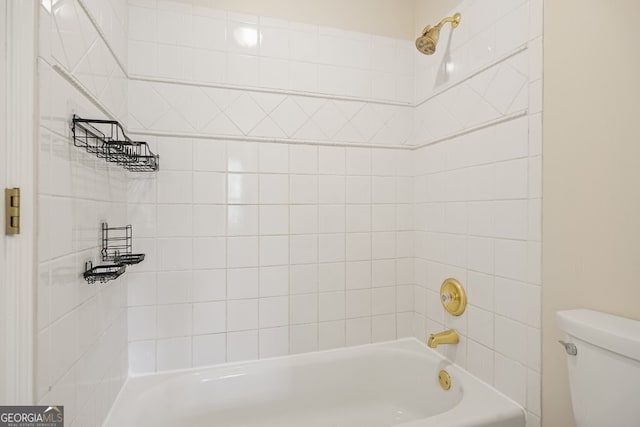 bathroom featuring toilet and shower / bathing tub combination