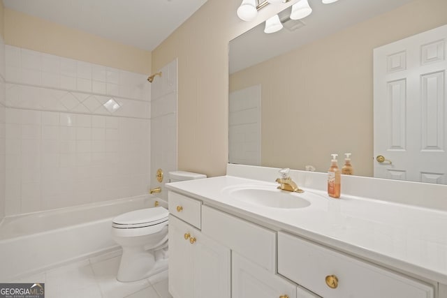 bathroom featuring toilet, tile patterned flooring, washtub / shower combination, and vanity