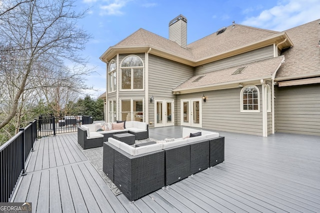 wooden terrace featuring french doors and an outdoor hangout area