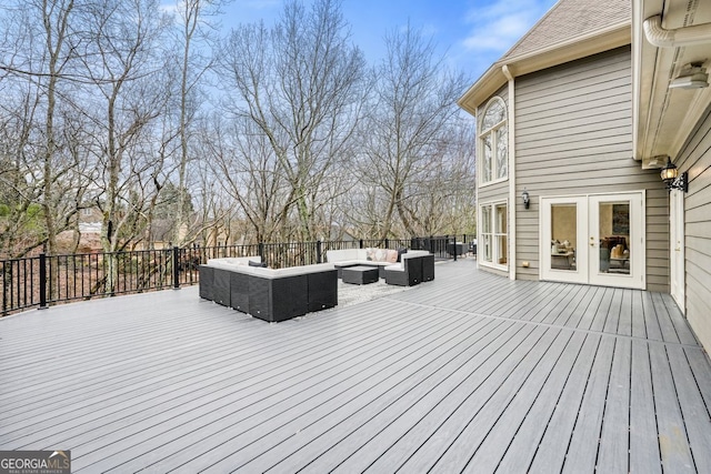 deck with french doors and an outdoor hangout area