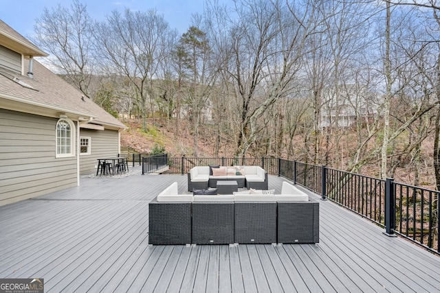 deck featuring outdoor dining space and an outdoor living space