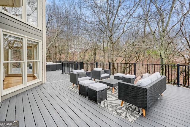 wooden terrace with outdoor lounge area