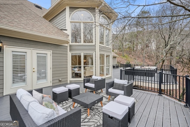 wooden deck featuring french doors and an outdoor hangout area