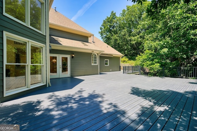 wooden deck featuring french doors