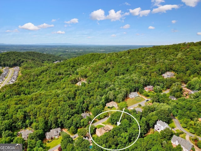 bird's eye view featuring a view of trees