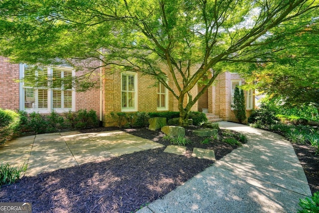 view of front of property featuring brick siding