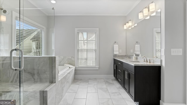 full bath with a garden tub, plenty of natural light, and a sink