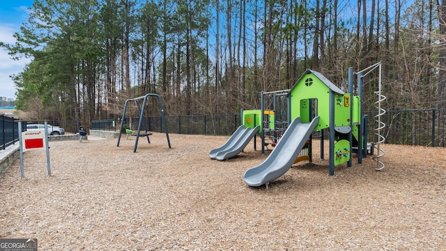 communal playground featuring fence