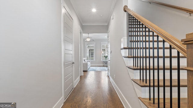 hall featuring recessed lighting, stairway, ornamental molding, wood finished floors, and baseboards