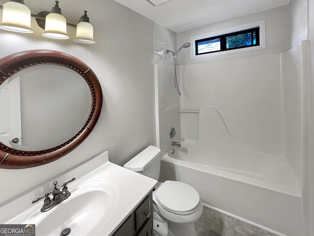 bathroom with  shower combination, vanity, and toilet