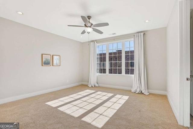 carpeted empty room featuring recessed lighting, a ceiling fan, and baseboards