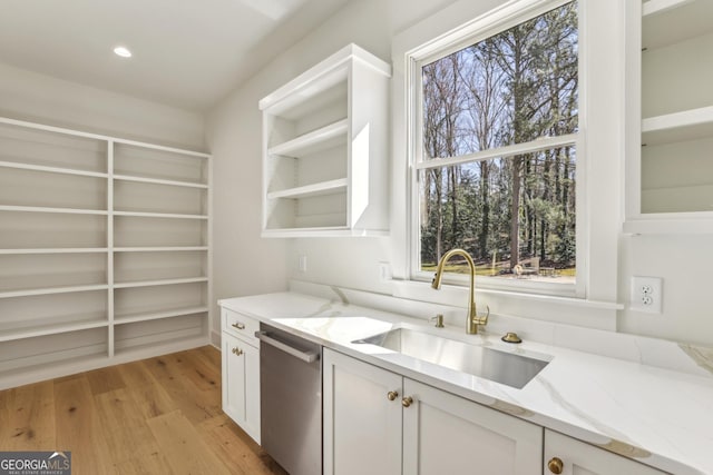 372 Karen Dr, Alpharetta, GA 30009 - kitchen with a sink, dishwasher, white cabinetry, light stone counters, and light wood finished floors