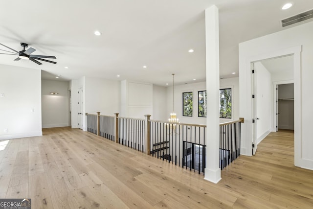 unfurnished room with light wood-style flooring, visible vents, baseboards, and recessed lighting