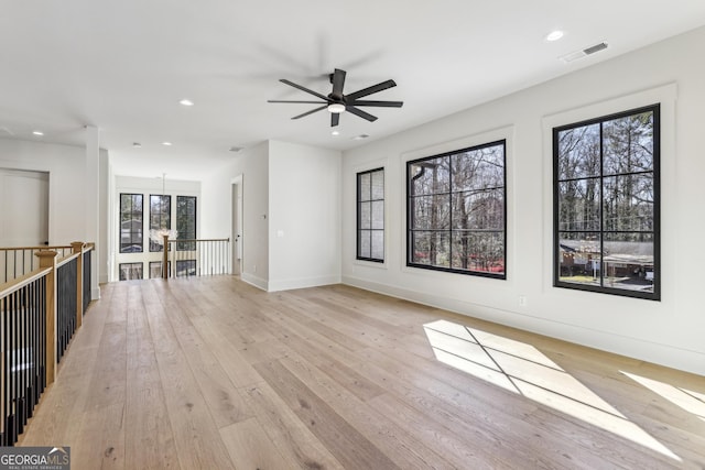 372 Karen Dr, Alpharetta, GA 30009 - unfurnished living room featuring light wood finished floors, a ceiling fan, recessed lighting, and baseboards
