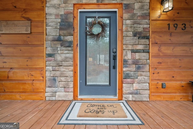 entrance to property with stone siding