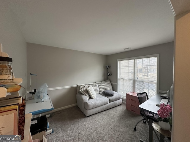 office area with carpet flooring, visible vents, and baseboards