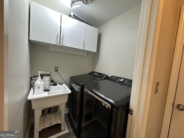 laundry area with cabinet space and washing machine and clothes dryer