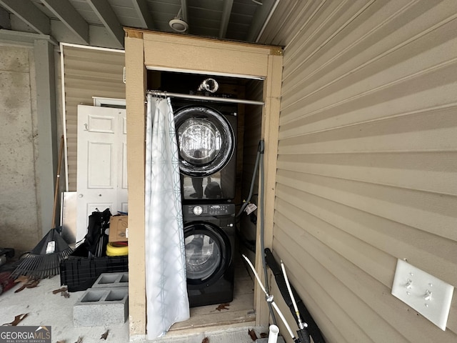 laundry area with laundry area and stacked washing maching and dryer