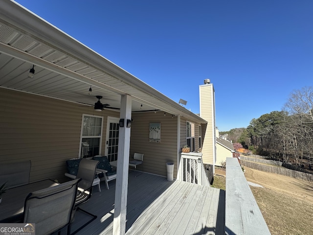 wooden terrace featuring ceiling fan