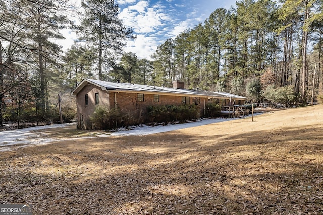 view of side of property featuring a chimney